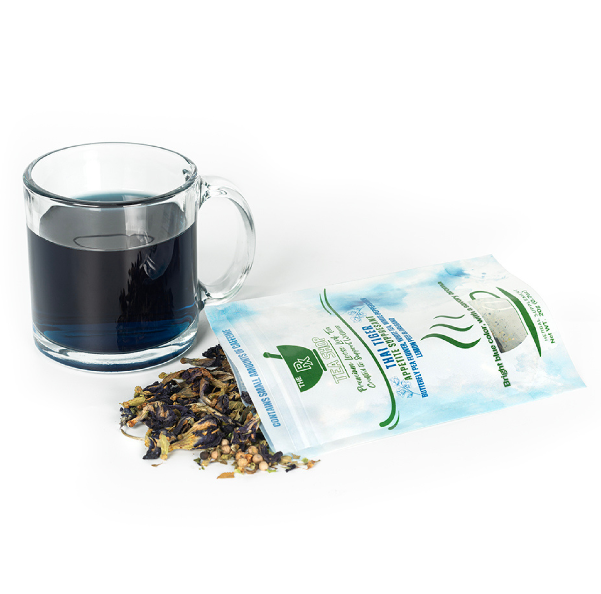 Tea bag packaging with a glass of blue tea and loose tea leaves on a white background